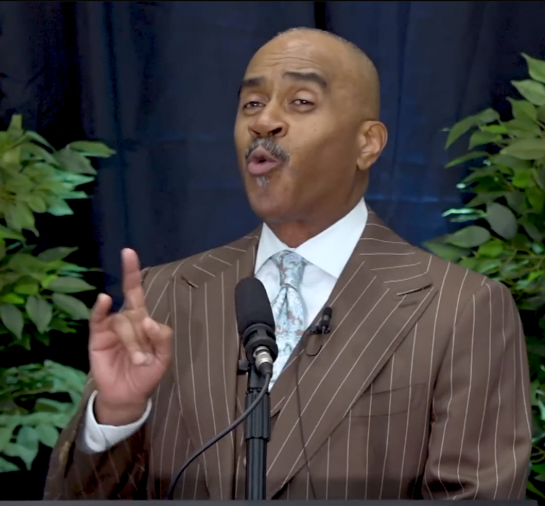 Apostle Gino Jennings showing hand sign?